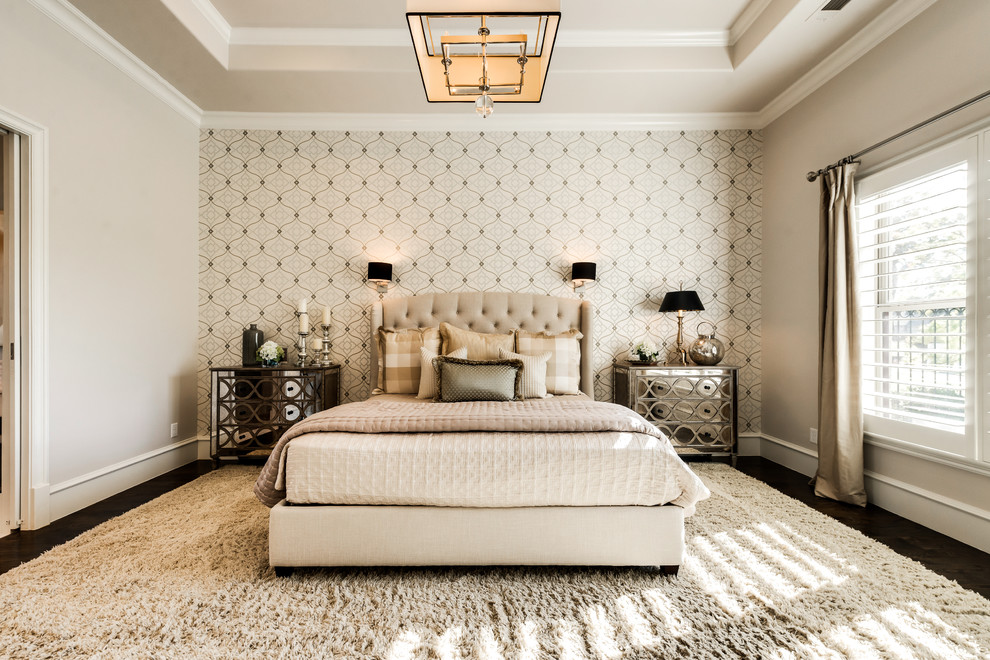 Inspiration for a large transitional master bedroom in Dallas with beige walls and dark hardwood floors.