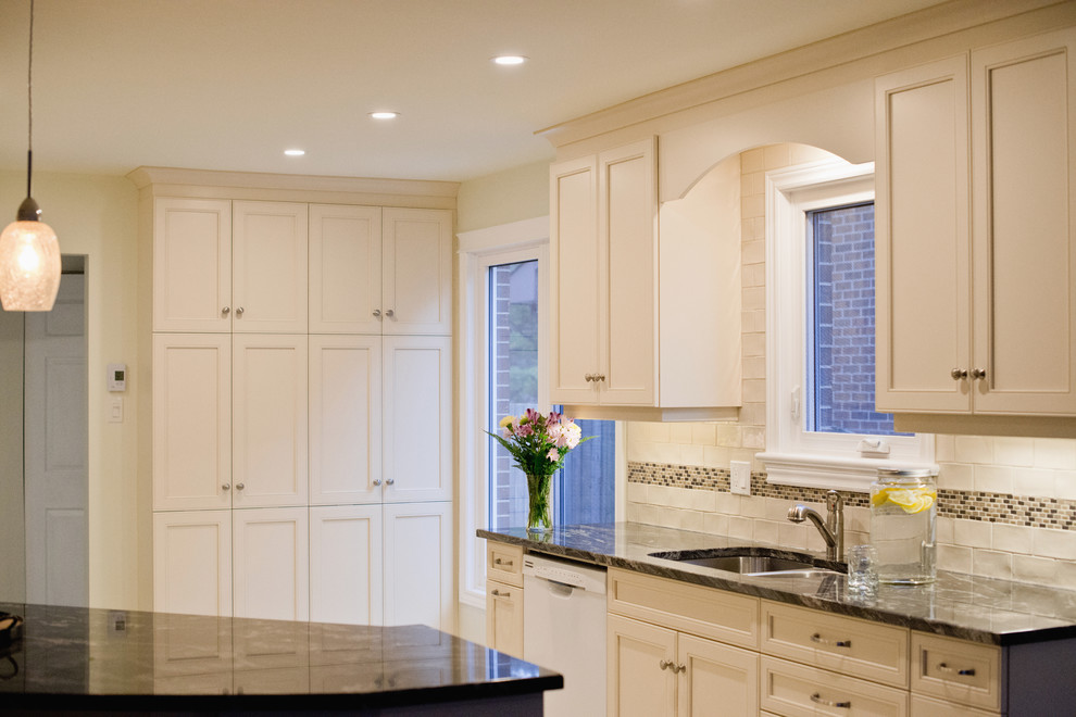 Example of a mid-sized transitional ceramic tile eat-in kitchen design in Ottawa with granite countertops, ceramic backsplash and an island