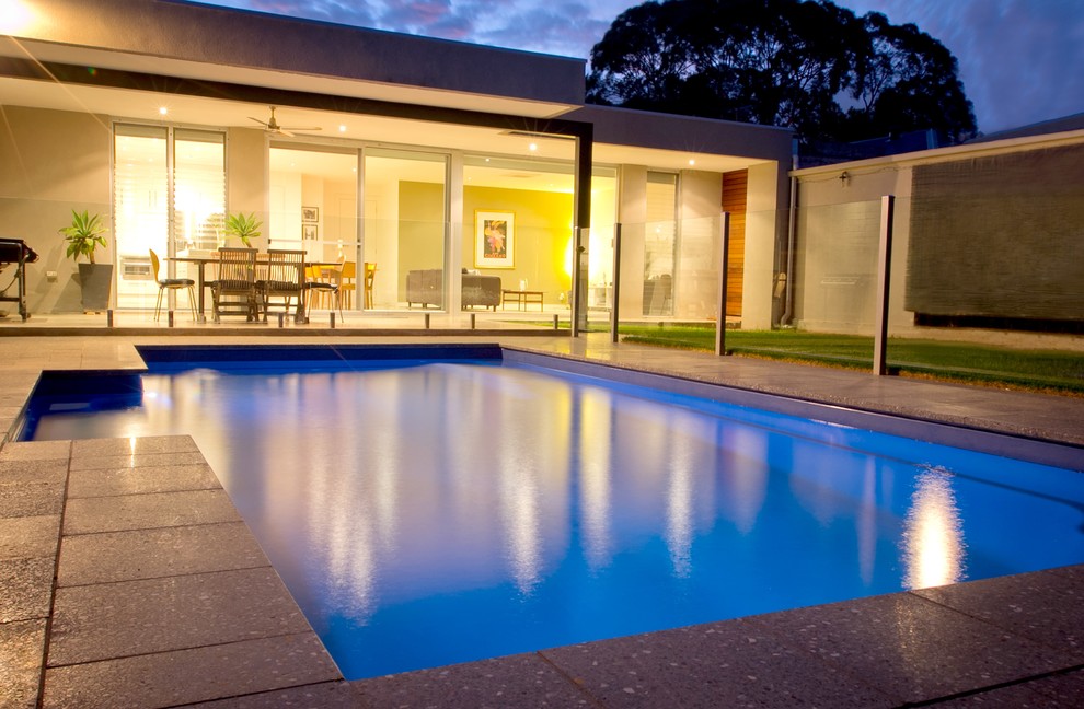 Design ideas for a mid-sized modern backyard rectangular pool in Adelaide.