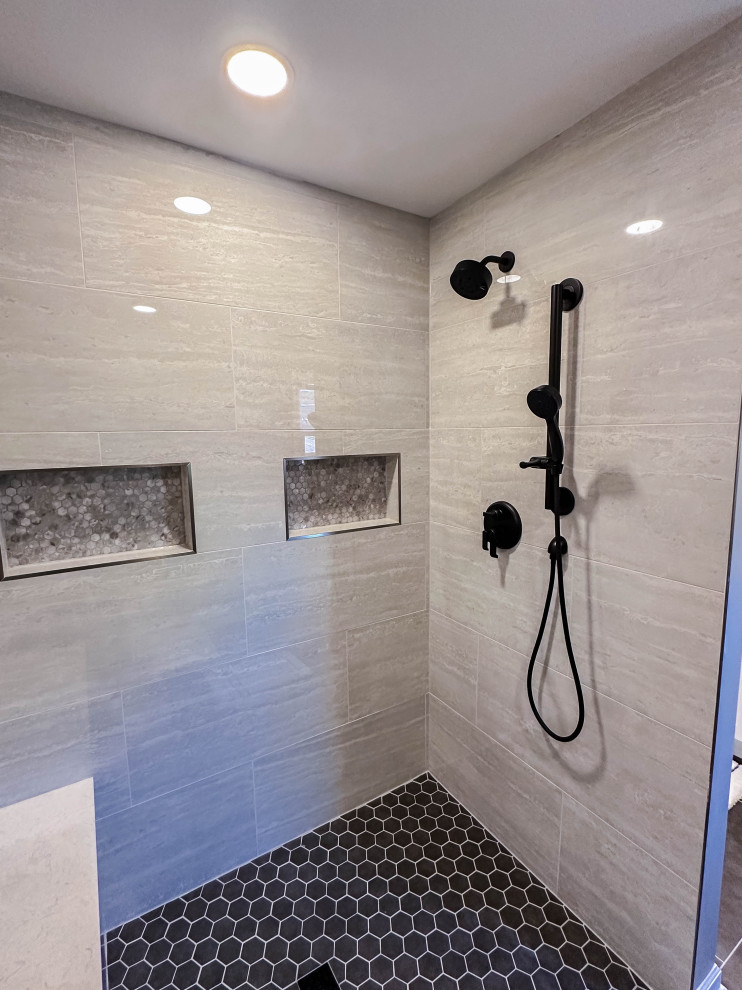 Inspiration for a large transitional master gray tile and porcelain tile porcelain tile and black floor walk-in shower remodel with gray walls and a hinged shower door