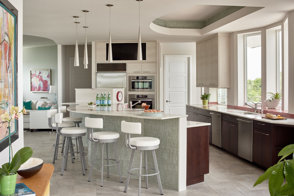 Contemporary kitchen in Raleigh with recycled glass benchtops and stainless steel appliances.