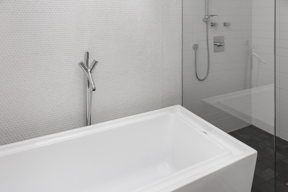 This is an example of a large contemporary master bathroom in Vancouver with a freestanding tub, an open shower, white tile, porcelain tile and porcelain floors.
