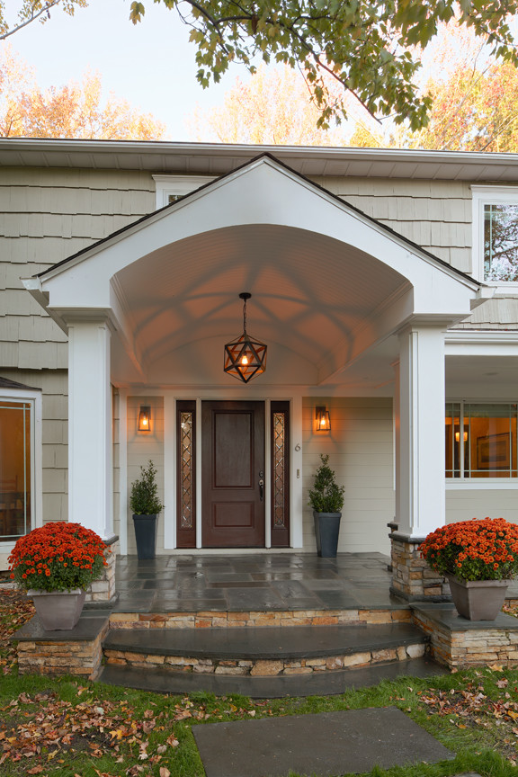 Mid-sized traditional front door in New York with a pivot front door and a dark wood front door.