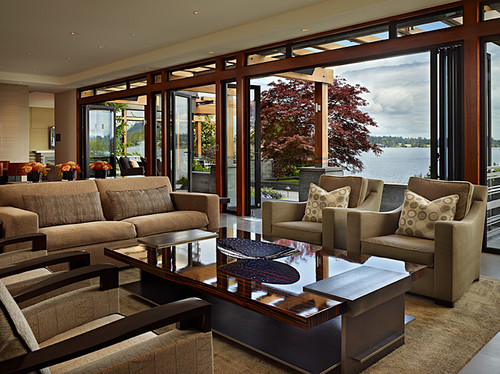 Natural light floods the living room in this indoor-outdoor home design.
