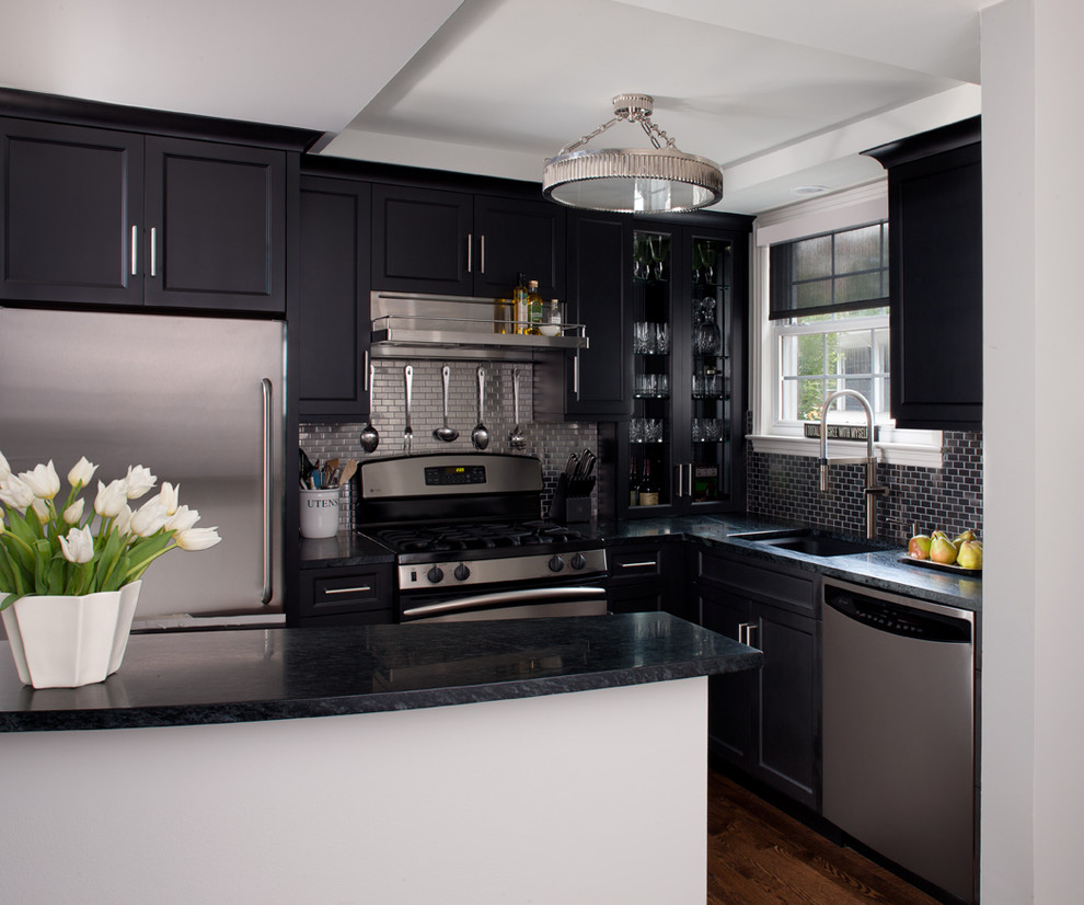 Inspiration for a small transitional l-shaped dark wood floor kitchen remodel in Detroit with recessed-panel cabinets, metallic backsplash, stainless steel appliances and white walls