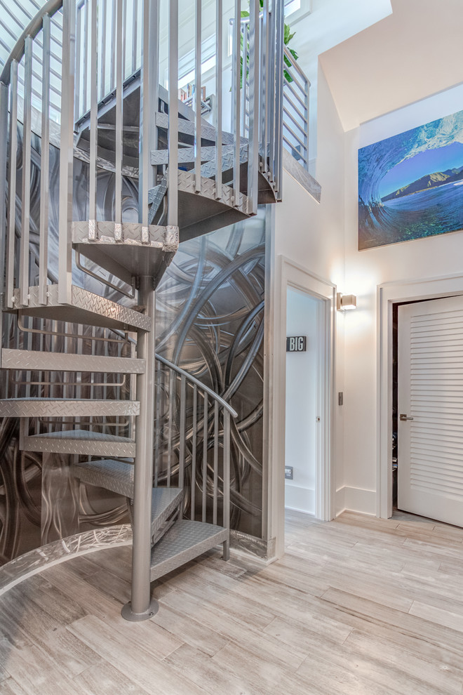 This is an example of a medium sized contemporary metal metal railing staircase in Wilmington.