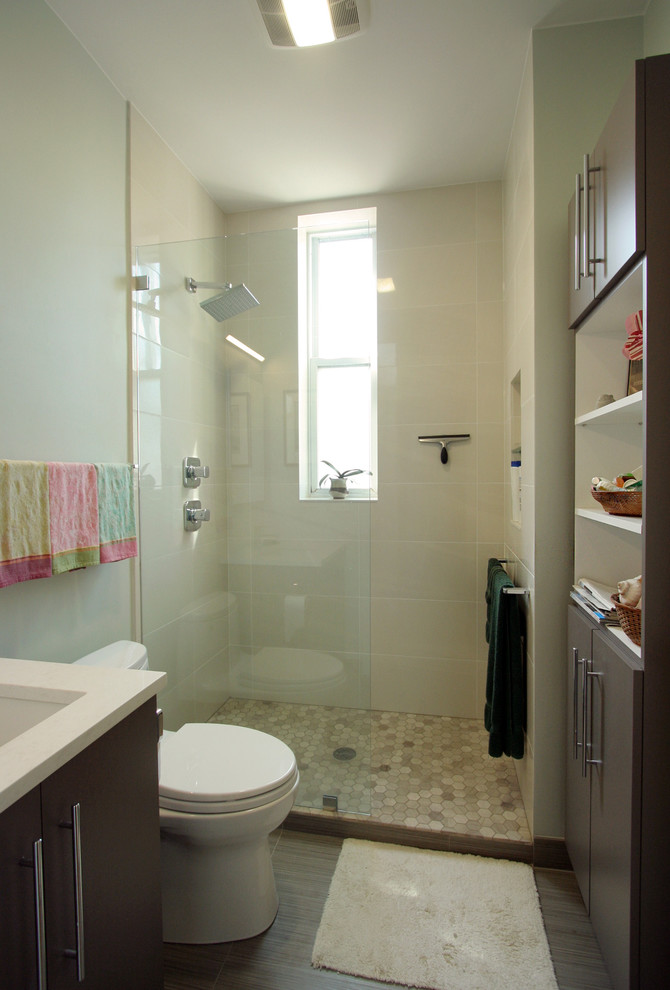 This is an example of a small modern 3/4 bathroom in Chicago with an undermount sink, flat-panel cabinets, brown cabinets, engineered quartz benchtops, an alcove shower, beige tile, ceramic tile and beige walls.