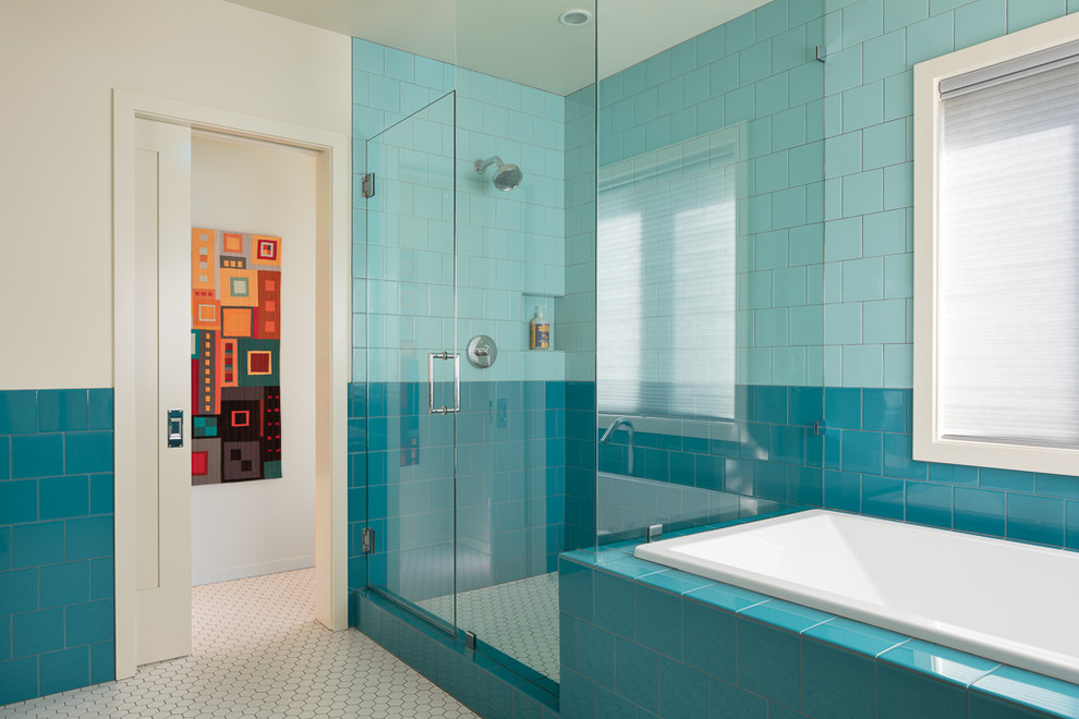 Design ideas for a mid-sized modern master bathroom in Portland with flat-panel cabinets, white cabinets, a drop-in tub, a corner shower, blue tile, porcelain tile, white walls, porcelain floors, an undermount sink, recycled glass benchtops, white floor and a hinged shower door.