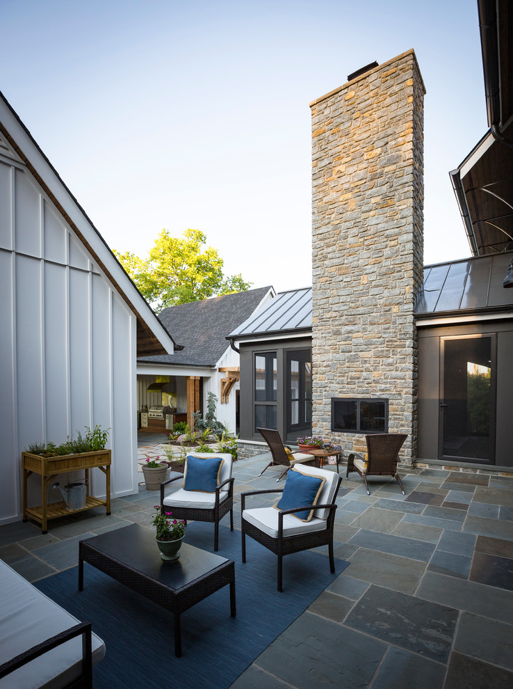 Country one-story concrete fiberboard white patio photo in Cincinnati