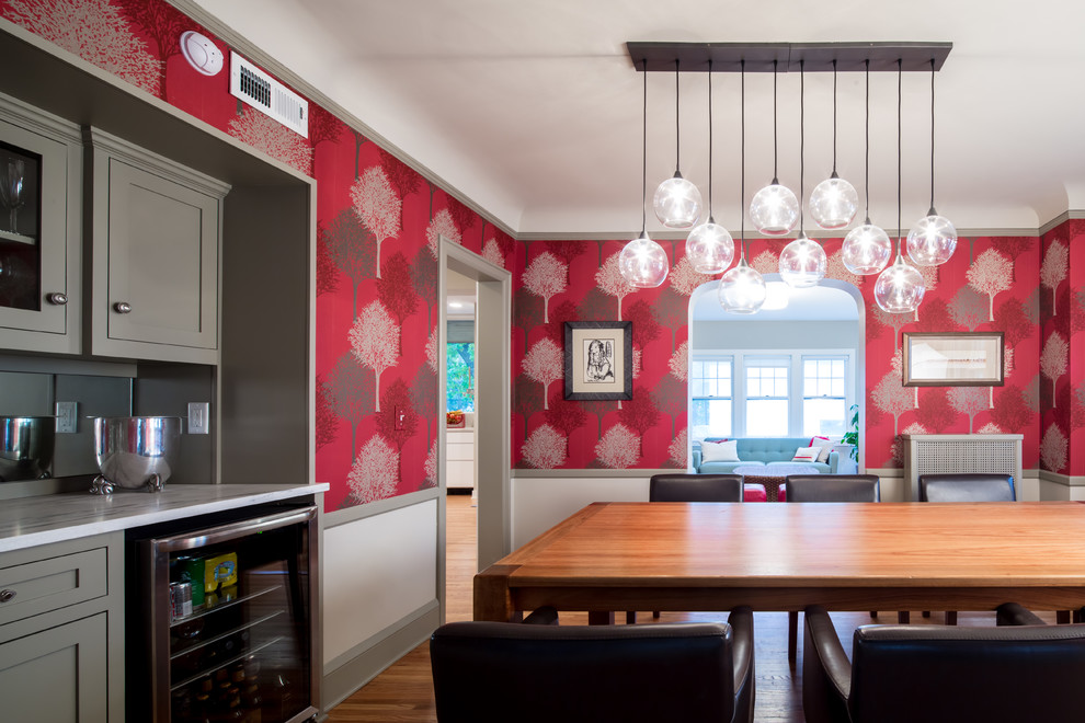 Mid-sized minimalist light wood floor enclosed dining room photo in Minneapolis with red walls and no fireplace