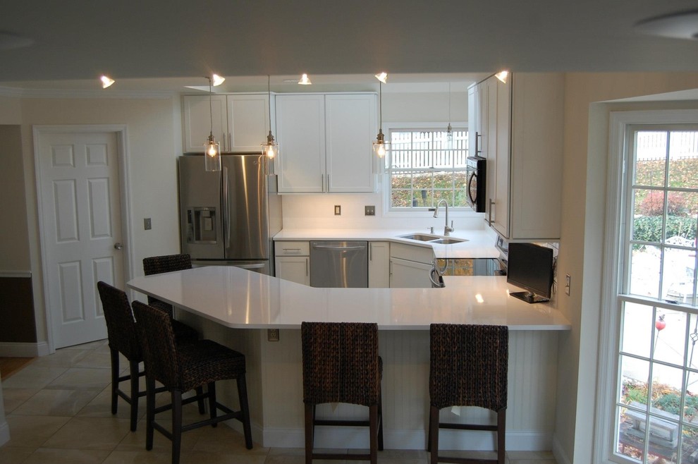 Inspiration for a small transitional u-shaped ceramic tile and beige floor open concept kitchen remodel in St Louis with a double-bowl sink, shaker cabinets, white cabinets, quartz countertops, stainless steel appliances, a peninsula and white countertops