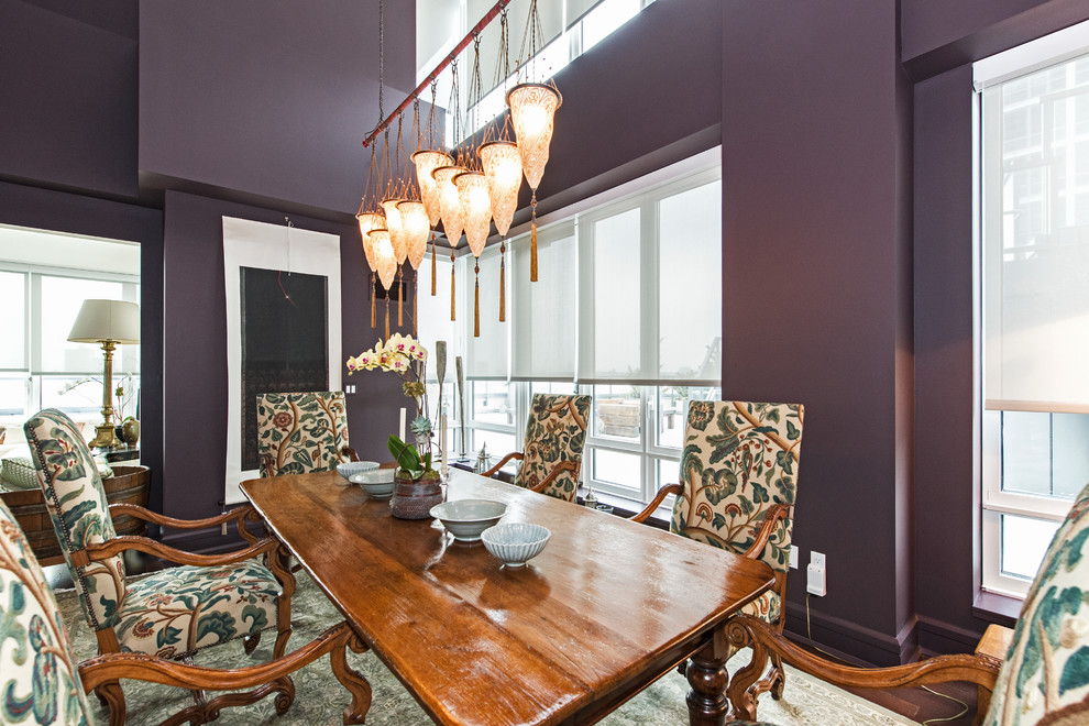 Photo of a large eclectic open plan dining in Miami with purple walls.
