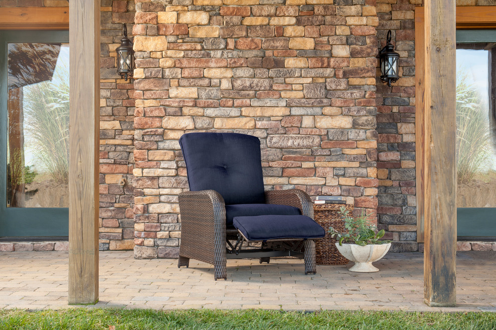 Example of a transitional backyard home design design