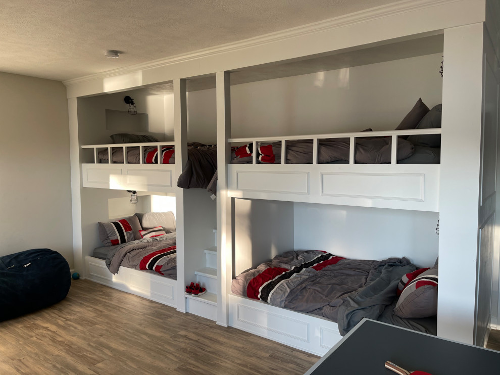 This is an example of a medium sized contemporary kids' bedroom in Cincinnati with grey walls, medium hardwood flooring and grey floors.