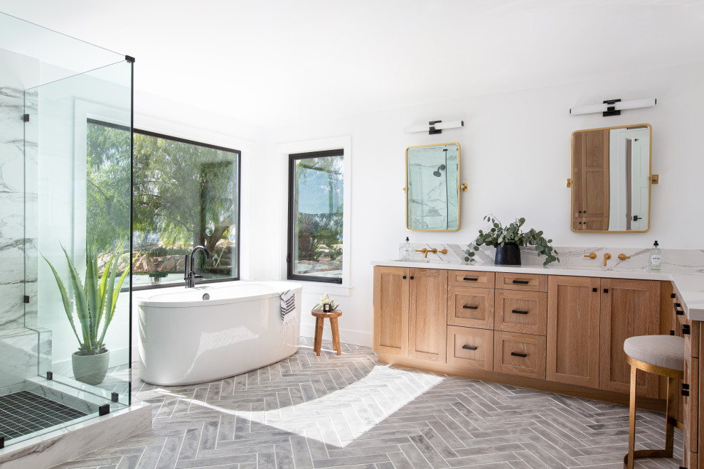 Inspiration for a transitional master bathroom in San Diego with shaker cabinets, medium wood cabinets, a freestanding tub, an alcove shower, gray tile, white tile, marble, white walls, an undermount sink, marble benchtops, grey floor, multi-coloured benchtops, a shower seat, a double vanity and a built-in vanity.