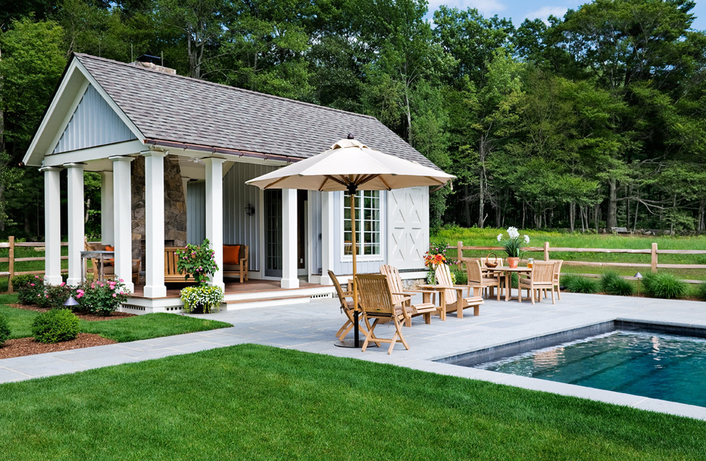 Inspiration for a traditional rectangular pool in New York with a pool house.
