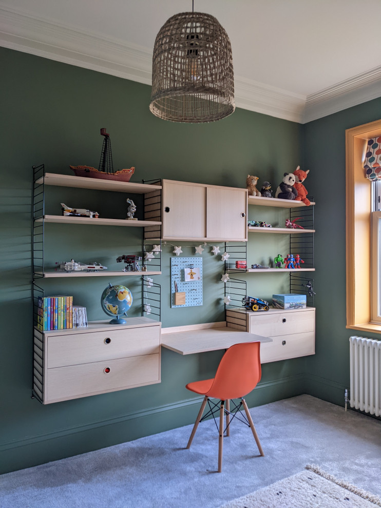 Design ideas for a mid-sized eclectic gender-neutral kids' bedroom for kids 4-10 years old in Other with green walls, carpet and grey floor.