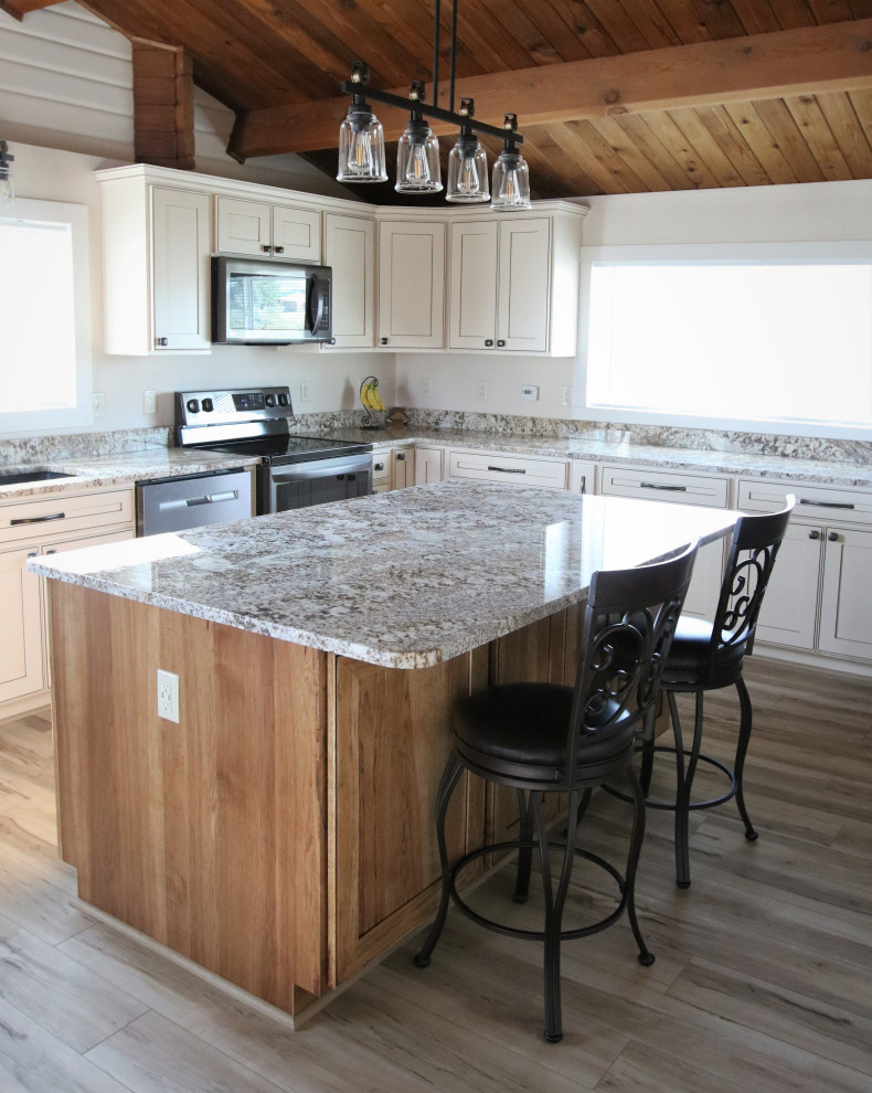 This is an example of a large country kitchen in Other with an undermount sink, shaker cabinets, granite benchtops, with island and multi-coloured benchtop.