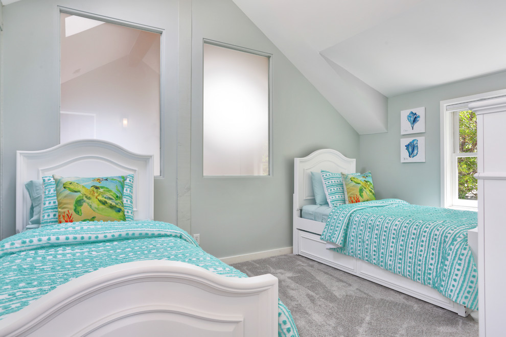 Photo of a mid-sized beach style gender-neutral kids' bedroom for kids 4-10 years old in Other with green walls, carpet and grey floor.