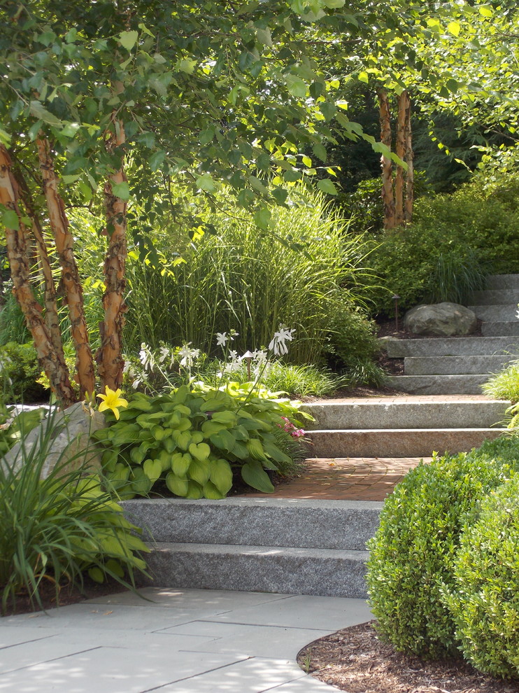 Traditional shaded garden in Boston with a garden path.
