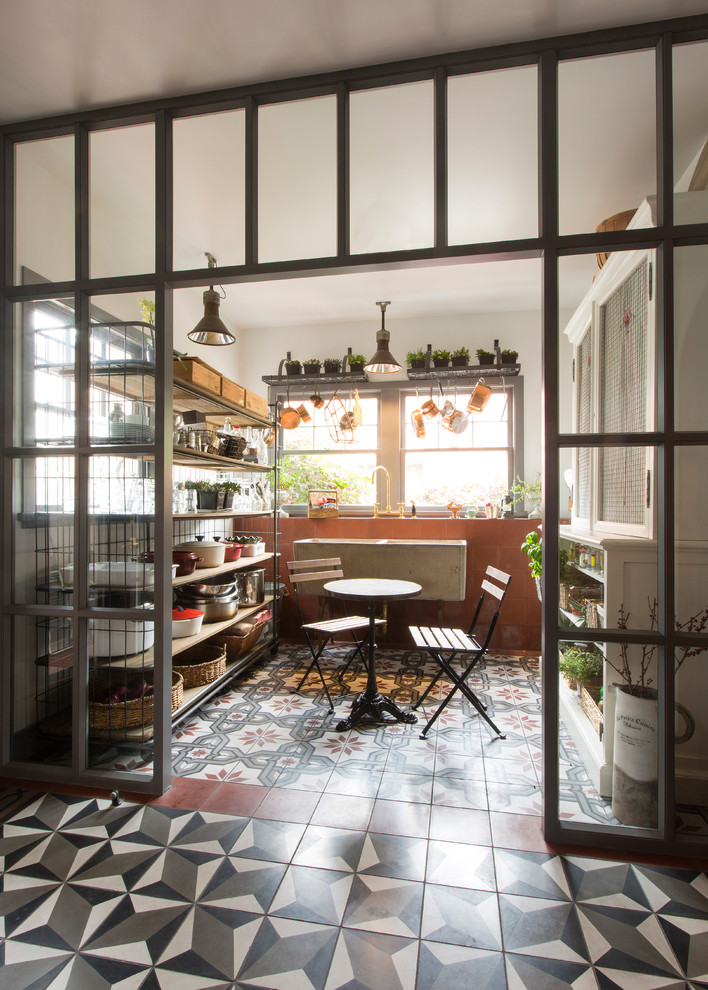 Inspiration for a large industrial concrete floor sunroom remodel in Los Angeles