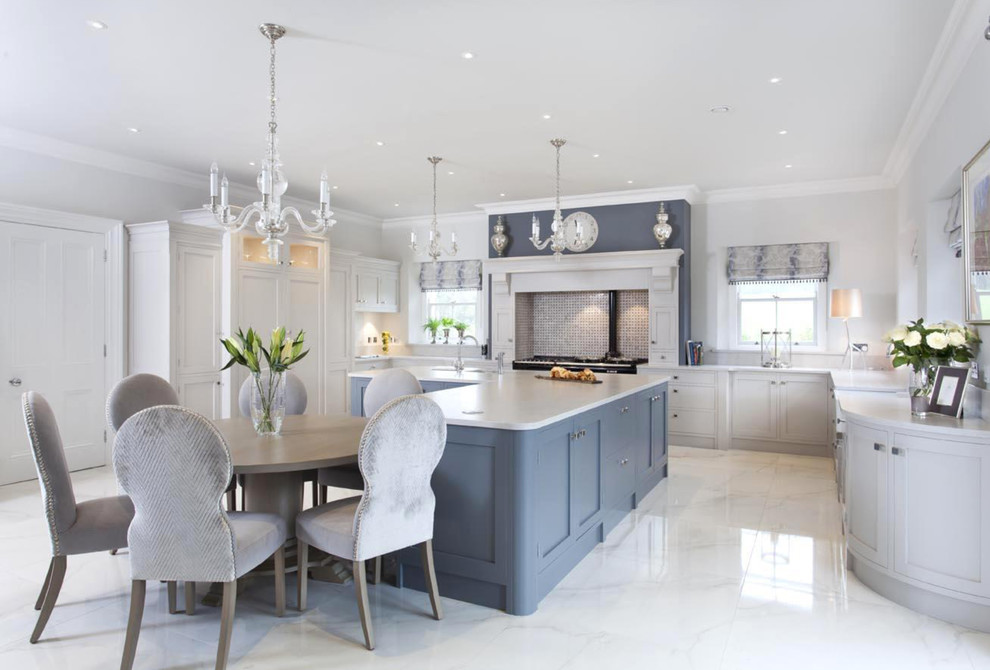 Large traditional u-shaped eat-in kitchen in Other with a farmhouse sink, shaker cabinets, grey cabinets, quartzite benchtops, multi-coloured splashback, mosaic tile splashback, stainless steel appliances, porcelain floors and with island.