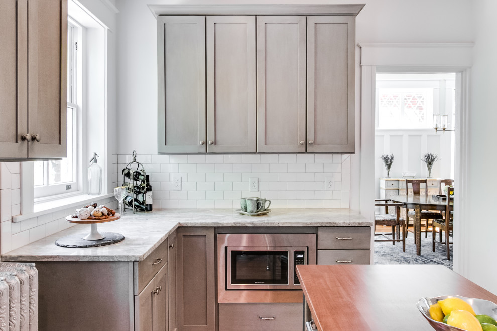 Large traditional u-shaped separate kitchen in Richmond with recessed-panel cabinets, grey cabinets, white splashback, ceramic splashback, stainless steel appliances and with island.