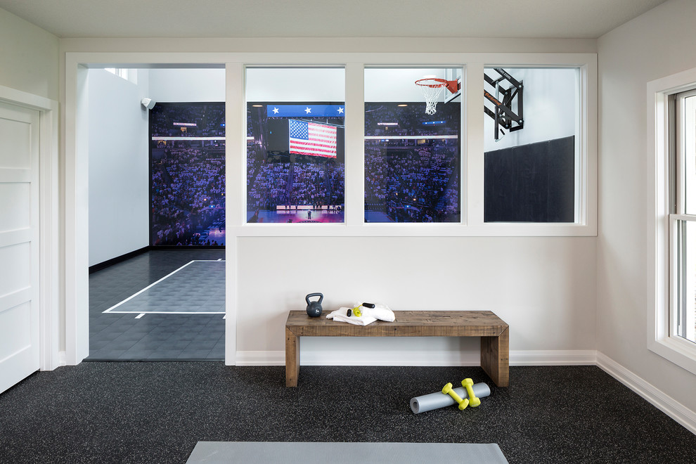 Inspiration for a mid-sized transitional indoor sport court in Minneapolis with white walls and grey floor.