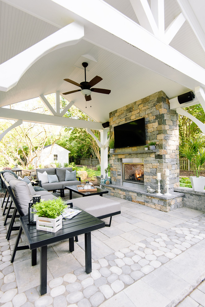 Large traditional backyard patio in Richmond with with fireplace, concrete pavers and a gazebo/cabana.