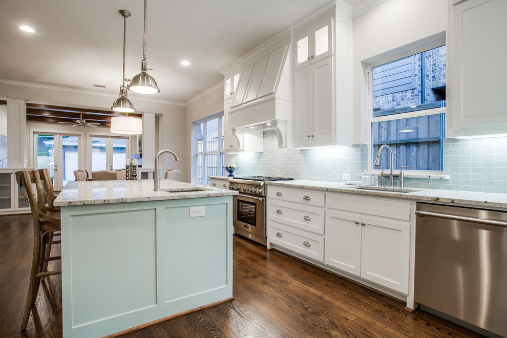 Inspiration for a large country l-shaped eat-in kitchen in Dallas with an undermount sink, shaker cabinets, white cabinets, granite benchtops, blue splashback, subway tile splashback, stainless steel appliances, dark hardwood floors and with island.