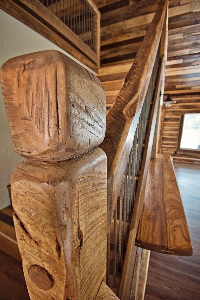 Large mountain style wooden l-shaped wood railing staircase photo with metal risers