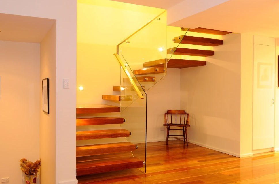 Inspiration for a contemporary wood floating staircase in Sydney with open risers.