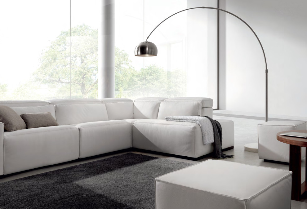 This is an example of a large contemporary formal enclosed living room in Miami with white walls, concrete floors, no fireplace, no tv and grey floor.