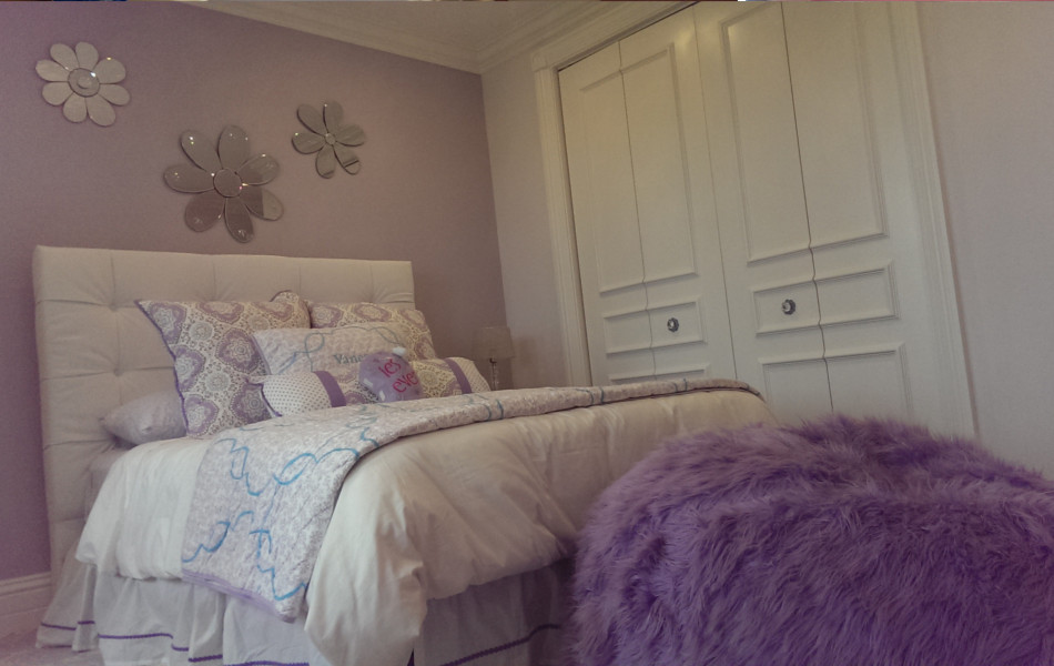 This is an example of a small traditional kids' bedroom for kids 4-10 years old and girls in Phoenix with purple walls and carpet.