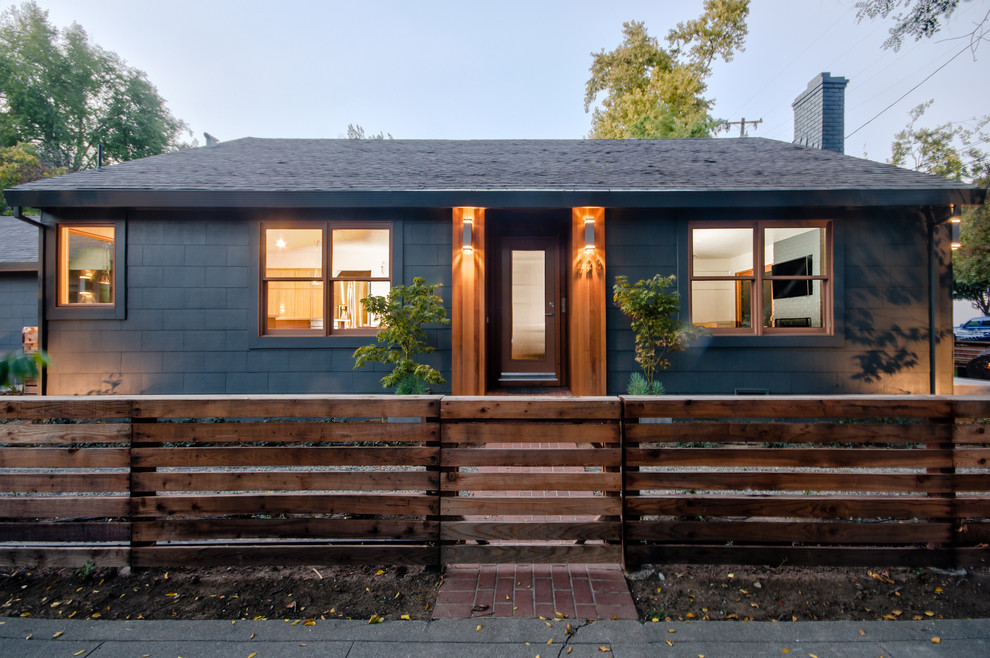 Design ideas for a mid-sized transitional one-storey grey exterior in Sacramento with wood siding and a gable roof.