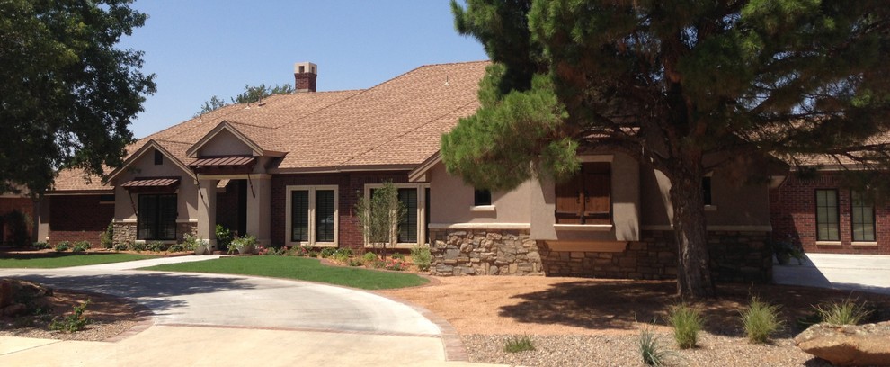 Example of a mid-sized mountain style one-story mixed siding beige home design design in Austin