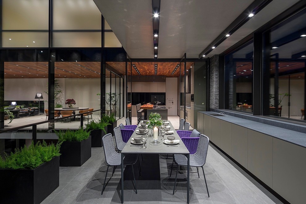 This is an example of a contemporary patio in Tokyo with an outdoor kitchen and no cover.