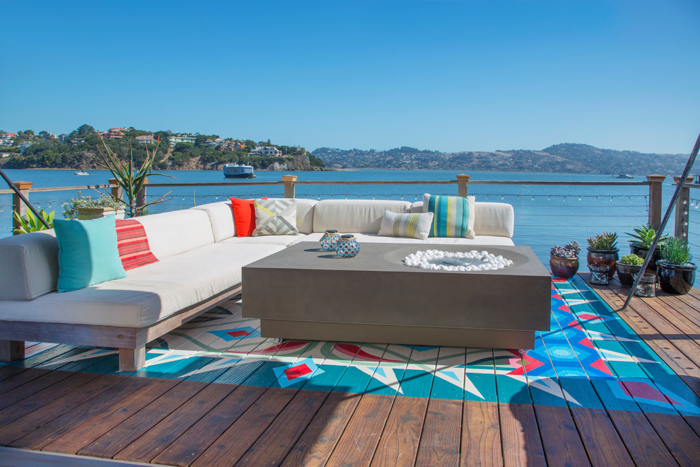 Design ideas for an eclectic backyard deck in San Francisco with with dock and no cover.
