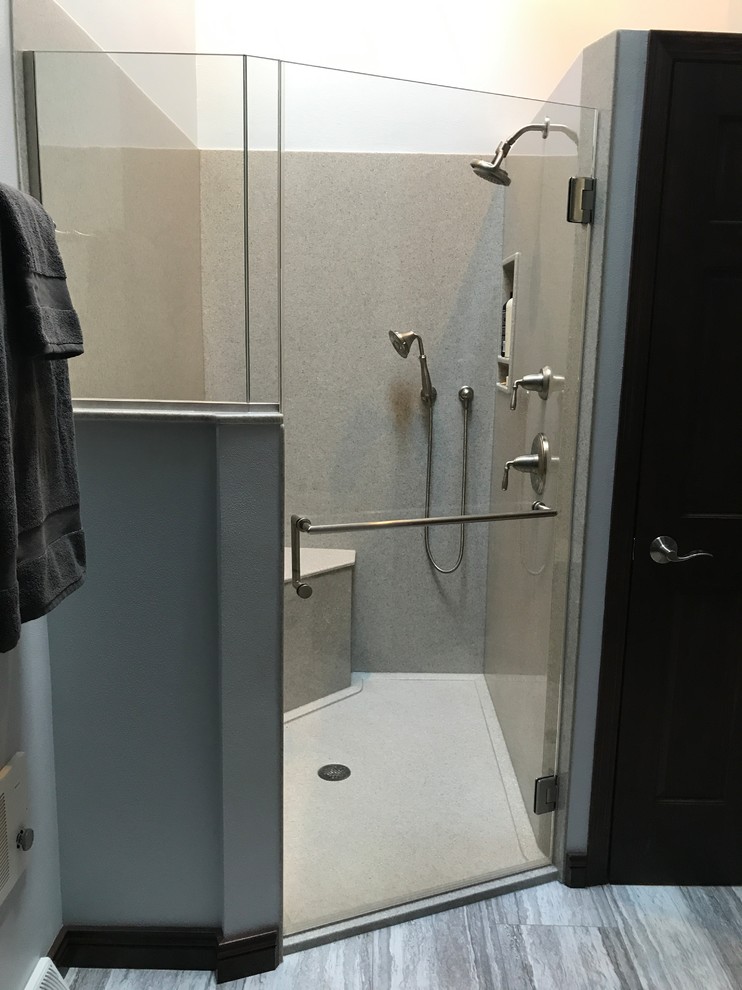 Mid-sized transitional master gray tile gray floor bathroom photo in Milwaukee with shaker cabinets, dark wood cabinets, a two-piece toilet, gray walls, an undermount sink and quartz countertops