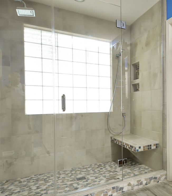 Large transitional master white tile alcove shower photo with a hinged shower door