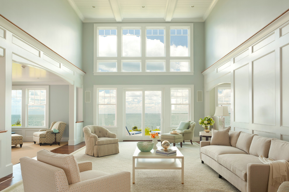 Photo of a large beach style open concept living room in Boston with grey walls and dark hardwood floors.