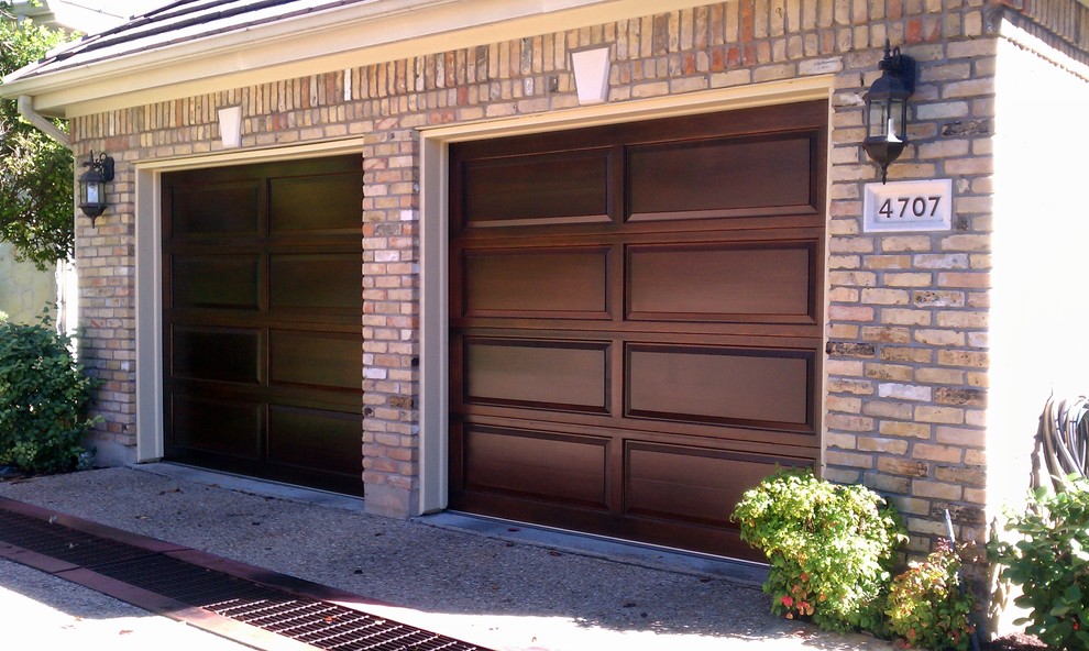 Inspiration for a mid-sized traditional attached two-car garage in Austin.