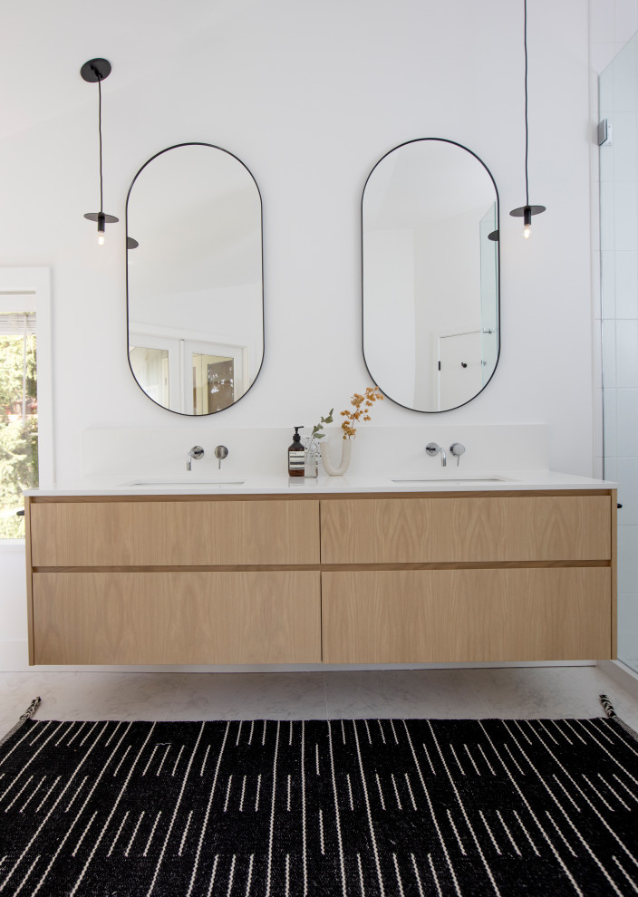 Bathroom - large scandinavian master white floor and double-sink bathroom idea in Vancouver with flat-panel cabinets, brown cabinets, a one-piece toilet, a drop-in sink, a hinged shower door, white countertops and a floating vanity