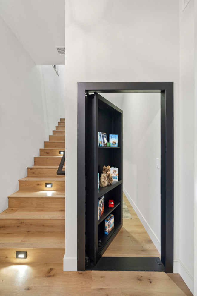 Inspiration for a contemporary wooden metal railing staircase remodel in Phoenix with wooden risers