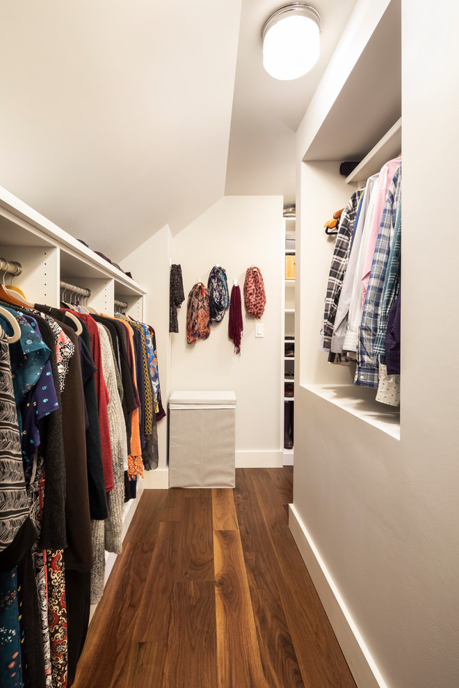Inspiration for a mid-sized transitional gender-neutral dark wood floor walk-in closet remodel in Seattle with open cabinets