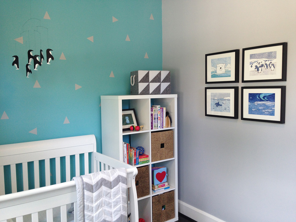 Design ideas for a small modern nursery for boys in DC Metro with grey walls and dark hardwood floors.