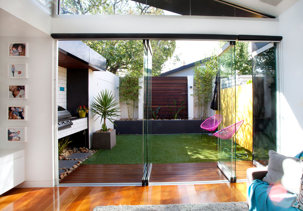 Design ideas for a small contemporary backyard patio in Melbourne with no cover and decking.