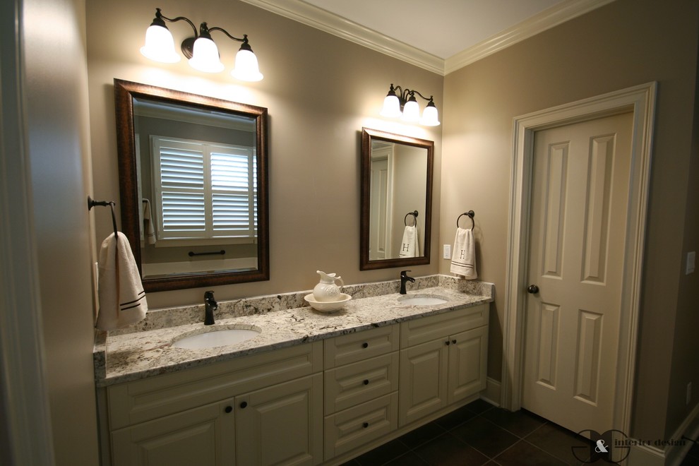 This is an example of a mid-sized transitional master bathroom in Atlanta with raised-panel cabinets, beige cabinets, an alcove tub, a two-piece toilet, gray tile, porcelain tile, grey walls, porcelain floors, an undermount sink, granite benchtops, brown floor, an alcove shower and a hinged shower door.