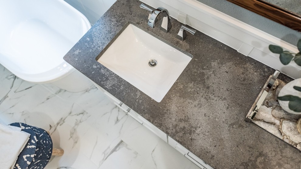 Design ideas for a contemporary master bathroom in Dallas with beaded inset cabinets, white cabinets, a freestanding tub, a corner shower, white tile, porcelain tile, blue walls, porcelain floors, an undermount sink, quartzite benchtops, white floor and grey benchtops.