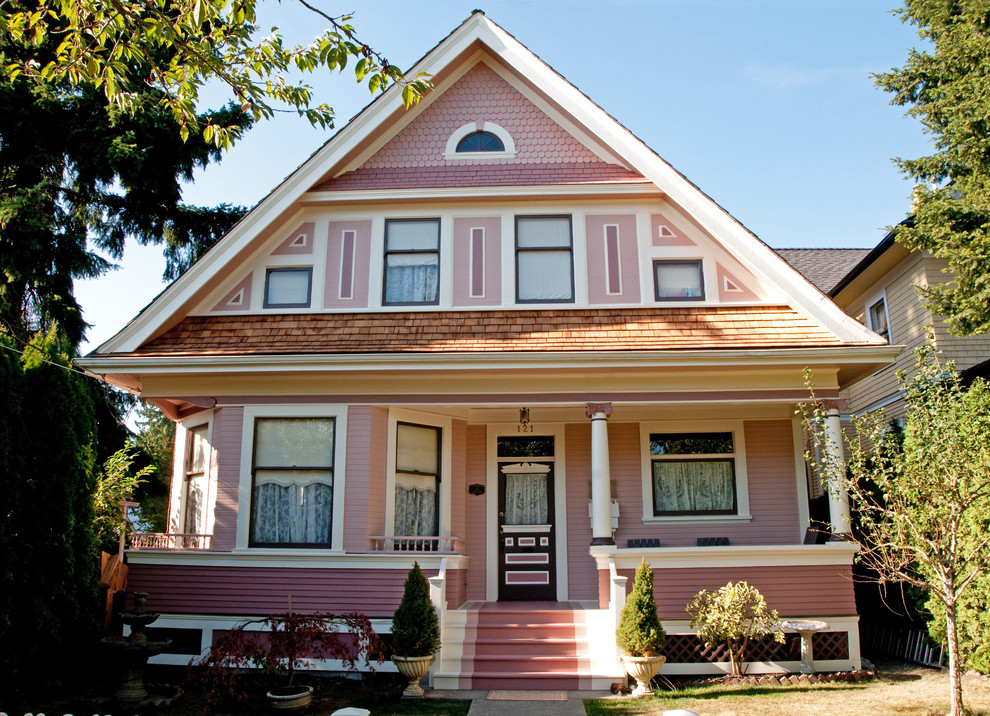 Traditional pink exterior in Vancouver with wood siding.